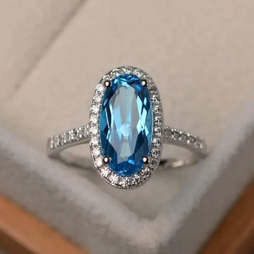 Vista 2 de YUANYI Anillo de compromiso de aniversario con topacio azul ovalado de moda vintage chapado en platino (Código 10 de EE. UU.)