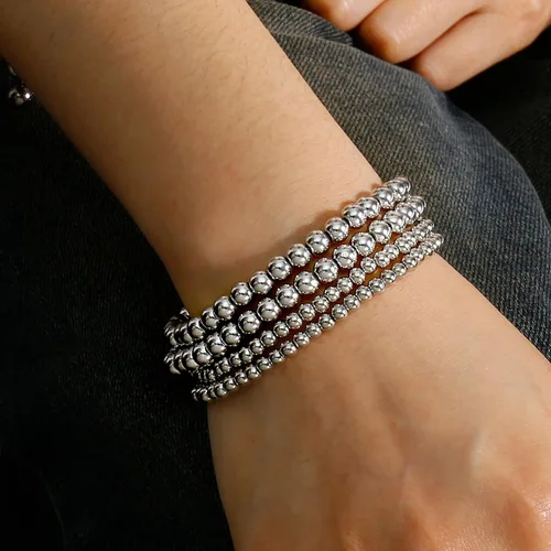 Vista 4 de Pulseras de cuentas de oro para mujer, juego apilable de bolas de cuentas, pulsera elástica elástica chapada en 14 quilates, joyería delicada