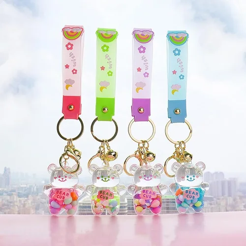 Vista 9 de Llavero Kawaii con diseño de oso líquido flotante de arena movediza, lindo llavero, bolsa, pulsera con dije para mujeres y niñas