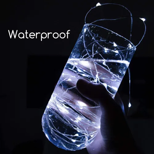 Vista 5 de Brightown Paquete de 12 luces de hadas con pilas de 7 pies para decoración navideña 20 LED Silver Wire Starry Light for Table Centerpieces, Mason