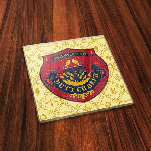 Vista 4 de Harry Potter – Logotipos de cerveza de mantequilla – Juego de cuatro posavasos de cristal de 4 x 4 pulgadas – Viene con un elegante posavasos