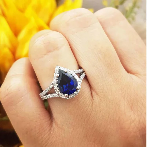 Vista 34 de Dazzlingrock Collection Anillo de compromiso con forma de lágrima y diamante blanco natural redondo de 0.45 quilates con halo de diamantes blancos