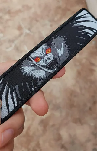 Vista 4 de Mamarmot Paquete de 2 llaveros de anime bordados con etiqueta de chorro de mochila para la cola del coche, llavero para llaves
