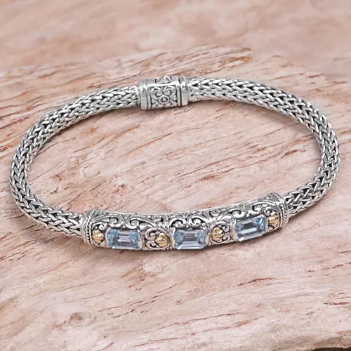 Vista 5 de NOVICA Pulsera trenzada artesanal de topacio azul con acento dorado y color vermeil de Bali Indonesia 1.8 pulgadas de largo x 0.3 pulgadas de ancho
