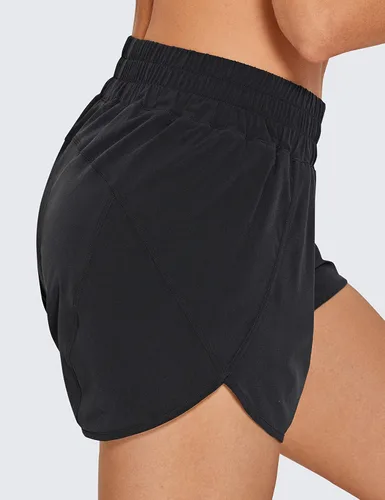 Vista 7 de CRZ YOGA Pantalones cortos para correr para mujer, talle alto, con bolsillo con cremallera, forro de malla, entrepierna de 3 pulgadas, dobladillo