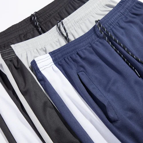 Vista 3 de Real Essentials Paquete de 3 pantalones deportivos de malla Tech para hombre con bolsillos (disponibles en tallas grandes y altas)