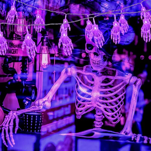 Vista 7 de JMEXSUSS Guirnalda de luces moradas de Halloween, 15.2 pies, 30 luces LED de mano de esqueleto, funciona con pilas, luces de Halloween