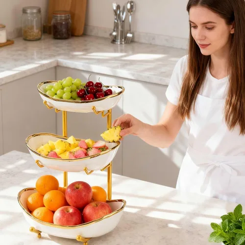 Vista 4 de jessie Cuencos de frutas de 3 niveles para encimera de cocina, soporte de cerámica grande para cestas de frutas, bandeja de metal para servir Dorado