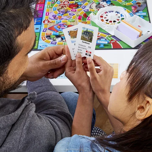 Vista 10 de Juego de mesa The Game of Life, juegos familiares para niños de 8 años en adelante, las clavijas vienen en 6 colores, juegos de mesa familiares