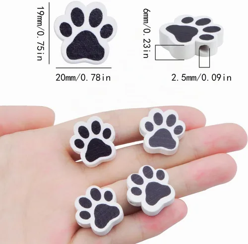 Vista 3 de 100 cuentas espaciadoras de madera con forma de huella de perro para mascotas, cuentas espaciadoras de madera en blanco y negro para hacer joyas
