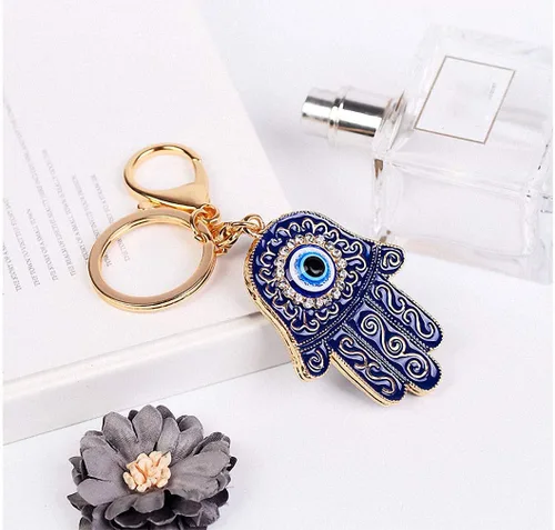Vista 7 de Llavero de ojo malvado de Fátima Hamsa, diamantes de imitación de cristal de resina, amuleto de Nazar de la suerte, palma para mujeres y hombres