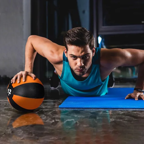 Vista 6 de Pelota medicinal Slam de 12 libras con peso y agarre texturizado de carcasa de goma para fuerza central, ejercicio, cardio, equilibrio y flexibilidad