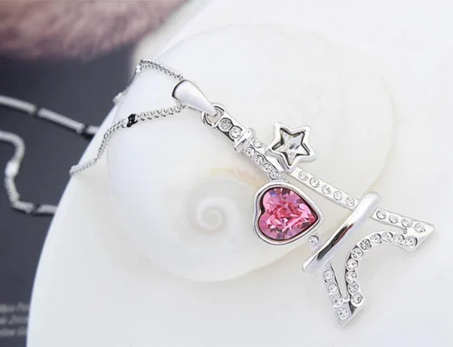 Vista 3 de NANA - Collar con colgante de torre Eiffel chapado en oro blanco con diseño de estrella de cristal Swarovski de corte de corazón