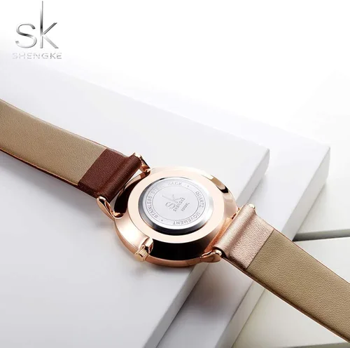 Vista 4 de SHENGKE Simplicity Creative - Reloj de pulsera para mujer, de cuero auténtico, elegante, para mujer, Movimiento de cuarzo