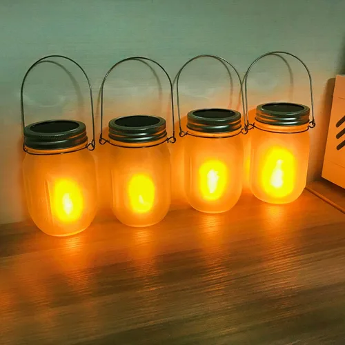 Vista 4 de Luces solares de antorcha parpadeante, paquete de 6 linternas parpadeantes impermeables para bailar, tarro de cristal integrado, patio al aire