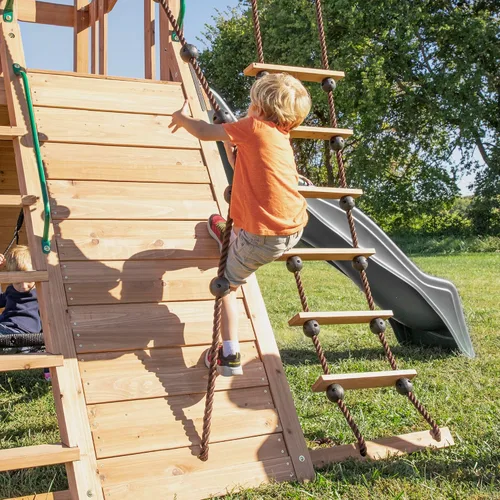 Vista 8 de Juego de columpio Backyard Discovery Endeavor de madera de cedro con tobogán de ola, plataforma de juego, doble pared de roca, escalera de cuerda