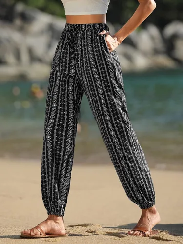 Vista 2 de SOLY HUX Pantalones acampanados con estampado floral de rayas tribales para mujer, cintura alta elástica, pierna acampanada, pantalones acampanados