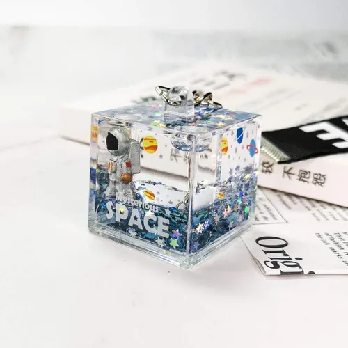 Vista 3 de LIANGLIN WU llavero para mujeres y hombres misterioso espacio purpurina arena movediza llavero cuadrado astronauta bolsa encanto llavero joyería