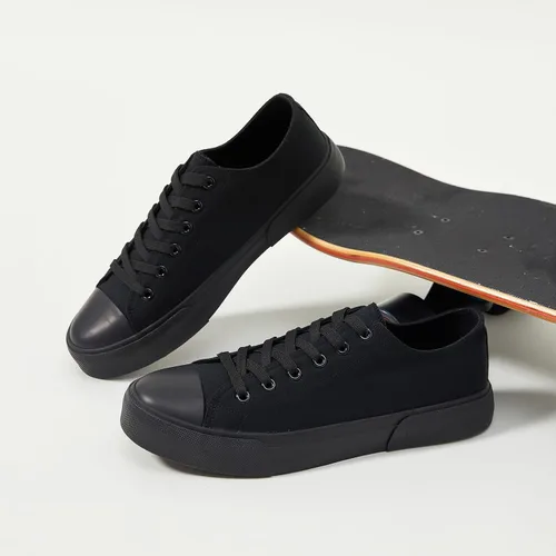 Vista 4 de yageyan Zapatos bajos de lona para hombre Zapatillas casuales clásicas Zapatos de moda en blanco y negro