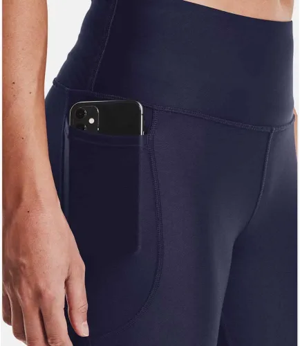 Vista 5 de Under Armour - Leggings capri con bolsillos para mujer, de tela HeatGear, de tiro alto y con pretina antideslizante