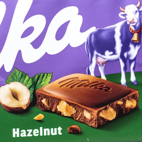 Vista 2 de Milka Avellanas Chocolate 3.53 oz