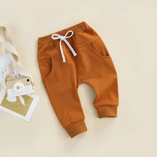 Vista 8 de Mubineo Pantalones deportivos básicos lisos para bebés, niños y niñas, cómodos pantalones de algodón con bolsillos