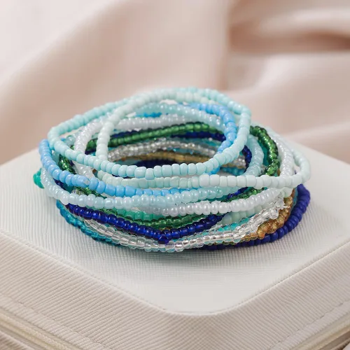 Vista 2 de Caiyao Juego de 36 pulseras elásticas coloridas con cuentas de semillas bohemias, multicapa, de arcoíris, pulsera elástica con cuentas de cristal