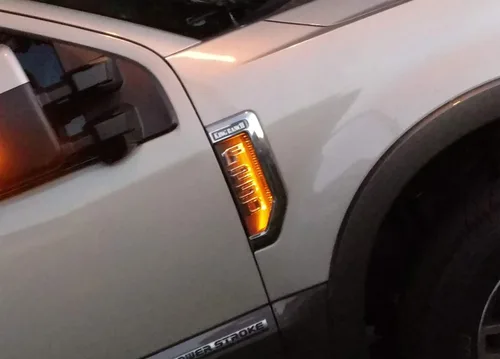 Vista 5 de iJDMTOY Kit de iluminación de fondo LED amarillo ámbar compatible con Ford F250 F350 F450 Super Duty 2017-2021 emblema cromado de guardabarros