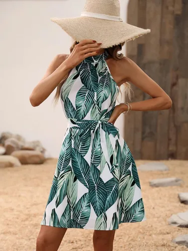 Vista 3 de WDIRARA Vestido acampanado acampanado con cuello halter y estampado tropical bohemio para mujer