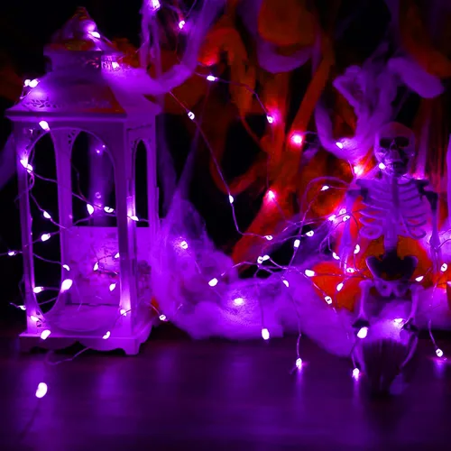Vista 5 de Paquete de 12 luces de Halloween moradas que funcionan con pilas, luces de cadena de 7 pies, 20 luces LED de hadas, luces mini impermeables, cable