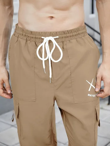 Vista 3 de OYOANGLE Pantalones cargo con cordón elástico en la cintura y bolsillo con solapa para hombre