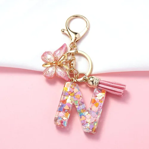 Vista 2 de OKAICEN Llavero con letra inicial del alfabeto, borla y mariposa, colgante para bolsos, mujeres y niñas
