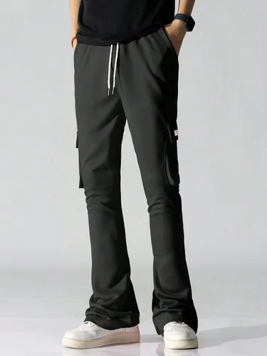 Vista 4 de GORGLITTER Pantalones cargo para hombre con cordón en la cintura, pantalones deportivos apilados Y2K con bolsillos con solapa y pierna ancha