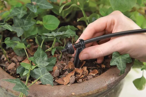 Vista 10 de Raindrip R560DP Sistema de riego por goteo, sistema de riego por goteo automático con temporizador para maceteros y canastas colgantes, riega hasta