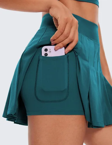 Vista 3 de CRZ YOGA Faldas de tenis plisadas de cintura alta para mujer, línea A, para entrenamiento atlético, golf, con bolsillos, estilo casual, patinadora