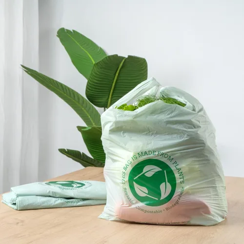 Vista 4 de Restaurantware -Bolsas de comestibles de tamaño 1/6, 100 bolsas de plástico duraderas - Asas de camiseta, bolsa de compras de plástico verde de alta