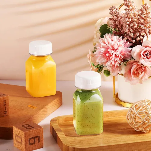 Vista 3 de Tanlade 24 botellas pequeñas de plástico de 4 onzas con tapas, recipientes transparentes reutilizables para jugos, licuados, chupitos de jengibre