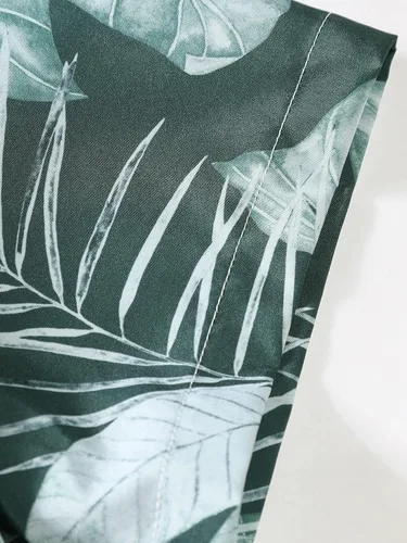 Vista 5 de OYOANGLE Camisa hawaiana de manga corta con botones y estampado tropical para hombre