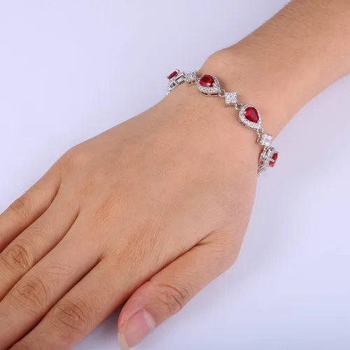 Vista 4 de EleQueen, juego nupcial de collar en V, pulsera tenis y aretes colgantes, con circonia cúbica, flor y lágrima, tono plateado, para mujer