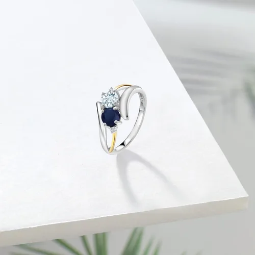 Vista 4 de Anillo cruzado de 2 piedras de plata esterlina 925 y oro amarillo de 10 quilates, azul aguamarina, zafiro azul aguamarina y diamante blanco