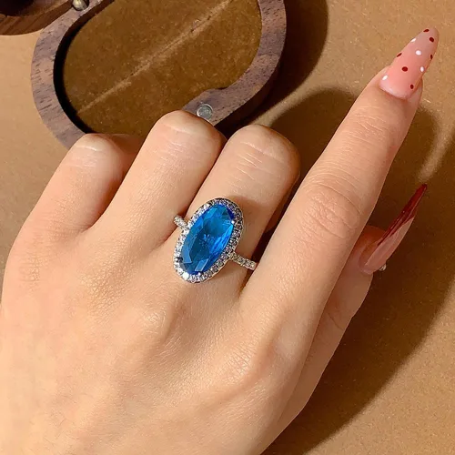 Vista 5 de YUANYI Anillo de compromiso de aniversario con topacio azul ovalado de moda vintage chapado en platino