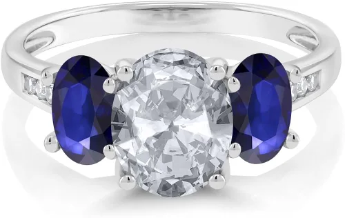 Vista 2 de Gem Stone King 10K White Gold Diamond Accent Oval White Topaz Blue Sapphire 3-Stone Ring 220 Ct Available 56789