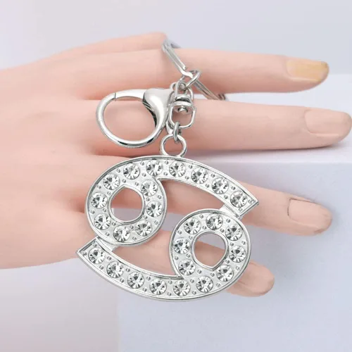 Vista 4 de CIAJIE Llavero de constelación, 2 paquetes de llavero de cristal creativo del zodiaco dorado y plateado, accesorios novedosos