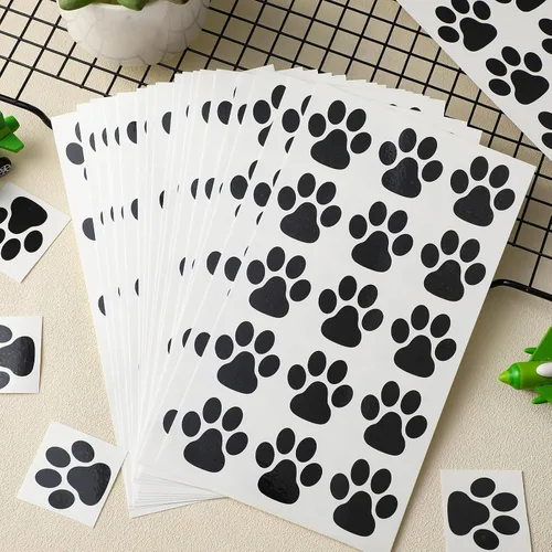 Vista 4 de Harloon 20 hojas de 300 tatuajes temporales de huellas de patas, tatuajes faciales para perros, calcomanías extraíbles para Cheer Patrol para Negro