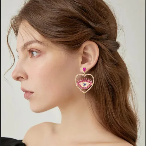 Vista 2 de Enrwin Aretes colgantes de cristal austriaco con forma de corazón y ojos abstractos para mujeres y niñas