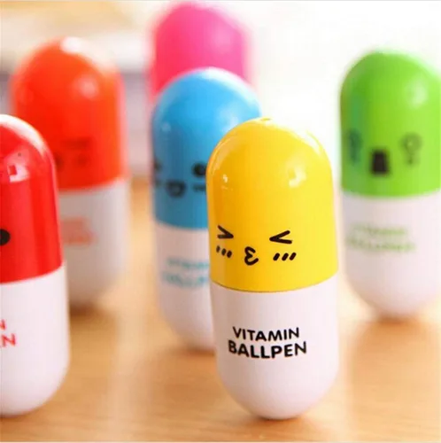 Vista 4 de 24 bolígrafos de píldora de vitaminas, bolígrafo de punta redonda retráctil novedoso con cara sonriente, lindo dibujo animado con emoción