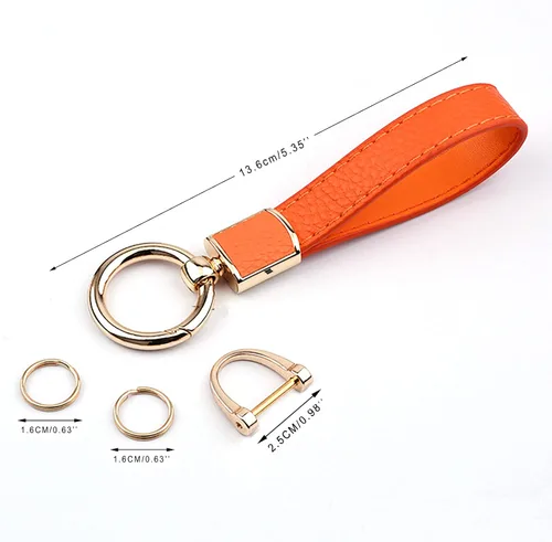 Vista 2 de Los soportes de cuero para llavero de automóvil de uso general para hombres y mujeres se pueden girar 360 grados, anillos en D antipérdida, hebilla