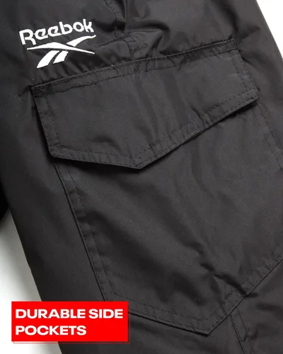 Vista 5 de Reebok Pantalones de nieve para niños Pantalones de snowboard pesados impermeables con bolsillos tipo cargo, polainas de nieve Pantalones de esquí