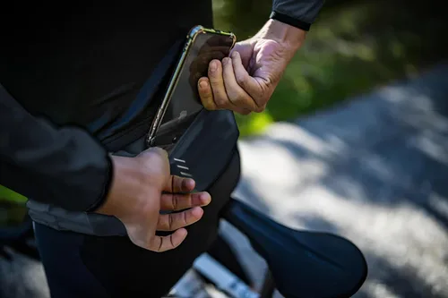 Vista 8 de Lo.gas Chaqueta de ciclismo para hombre, chaqueta cortavientos ligera plegable con bolsillos y tiras reflectantes