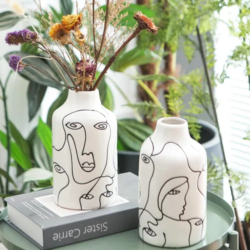 Vista 2 de Kimdio Juego de jarrones de cerámica, 2 jarrones de flores de diseño irregular abstracto blanco, decoración moderna del hogar, decoración de sala